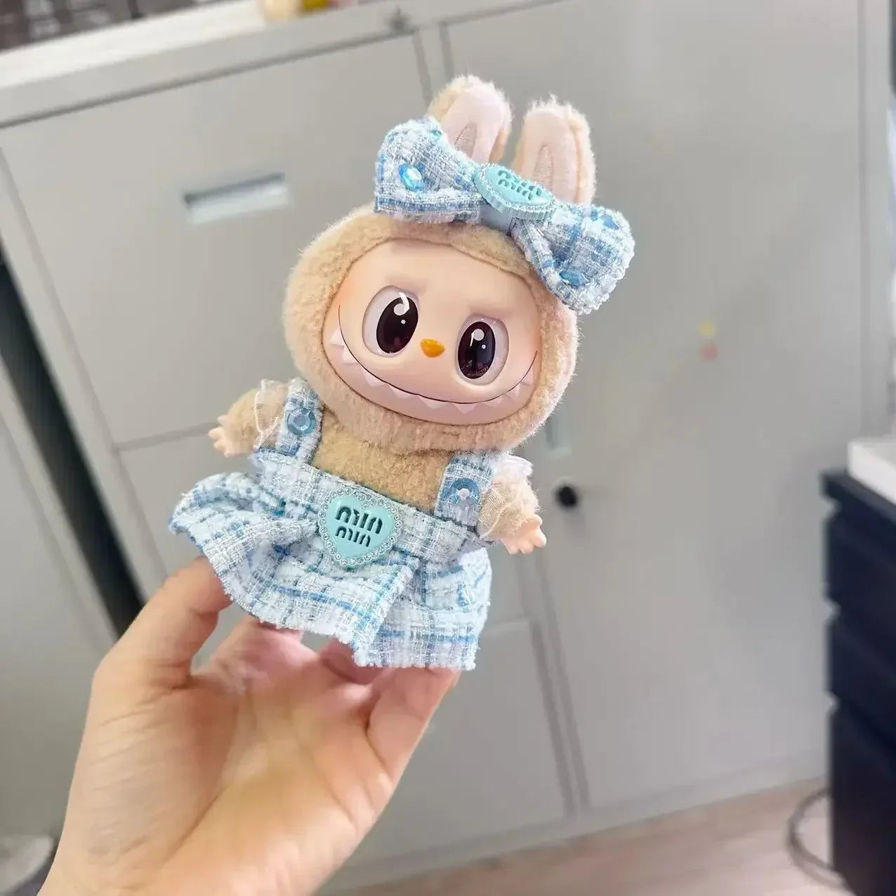 Shop the Labubu Designer Tweed Heart Dress & Ribbon – a stylish, high-quality doll outfit featuring a chic heart design and elegant ribbon. Perfect for collectors!